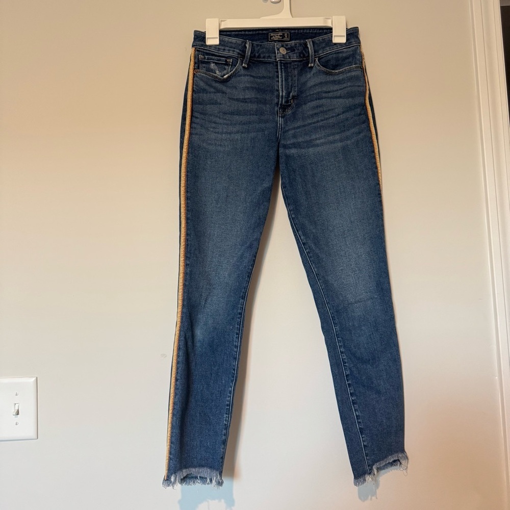 Abercrombie and Fitch Skinny Dark Wash Gold Bronze Side Stripe‎ Raw Hem 27